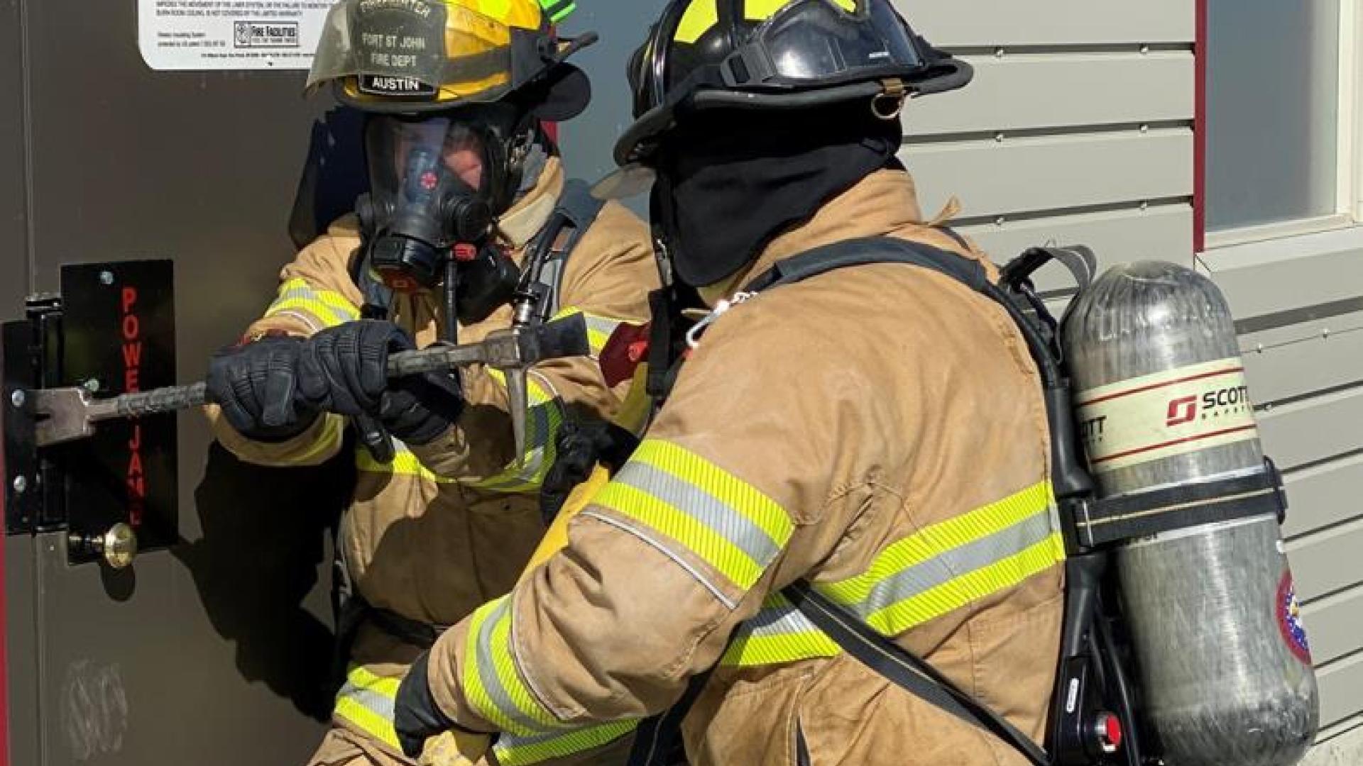 Firefighters training for fire fighting.