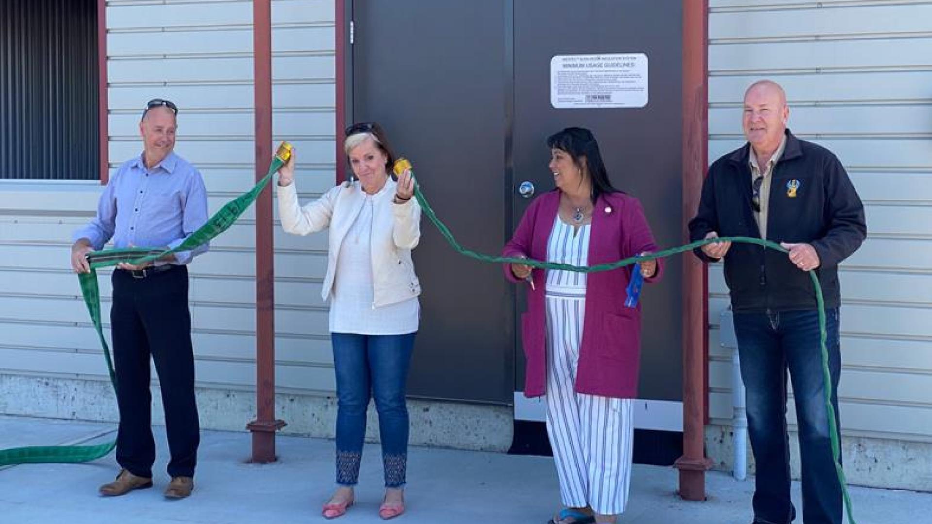 Mayor and Councillors officially open the Fire Training Centre with the uncoupling of a fire hose.