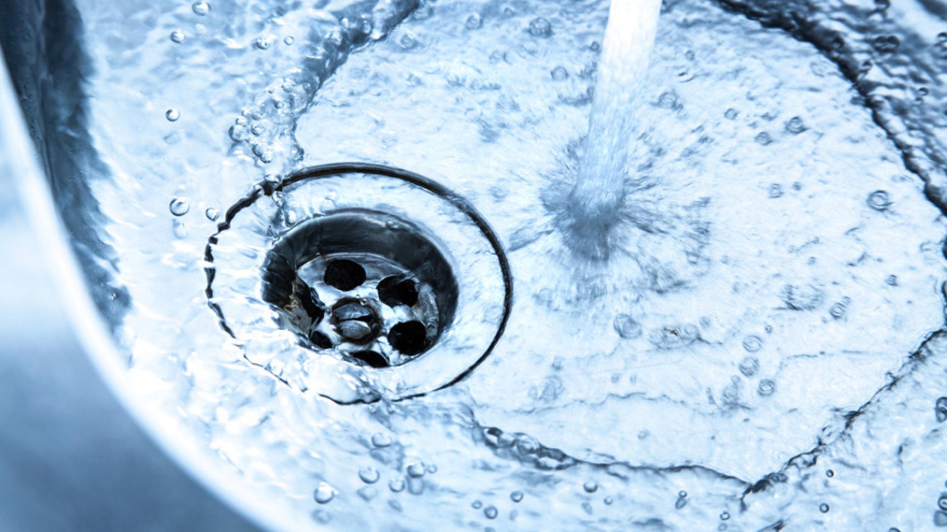 Water runs into a sink.