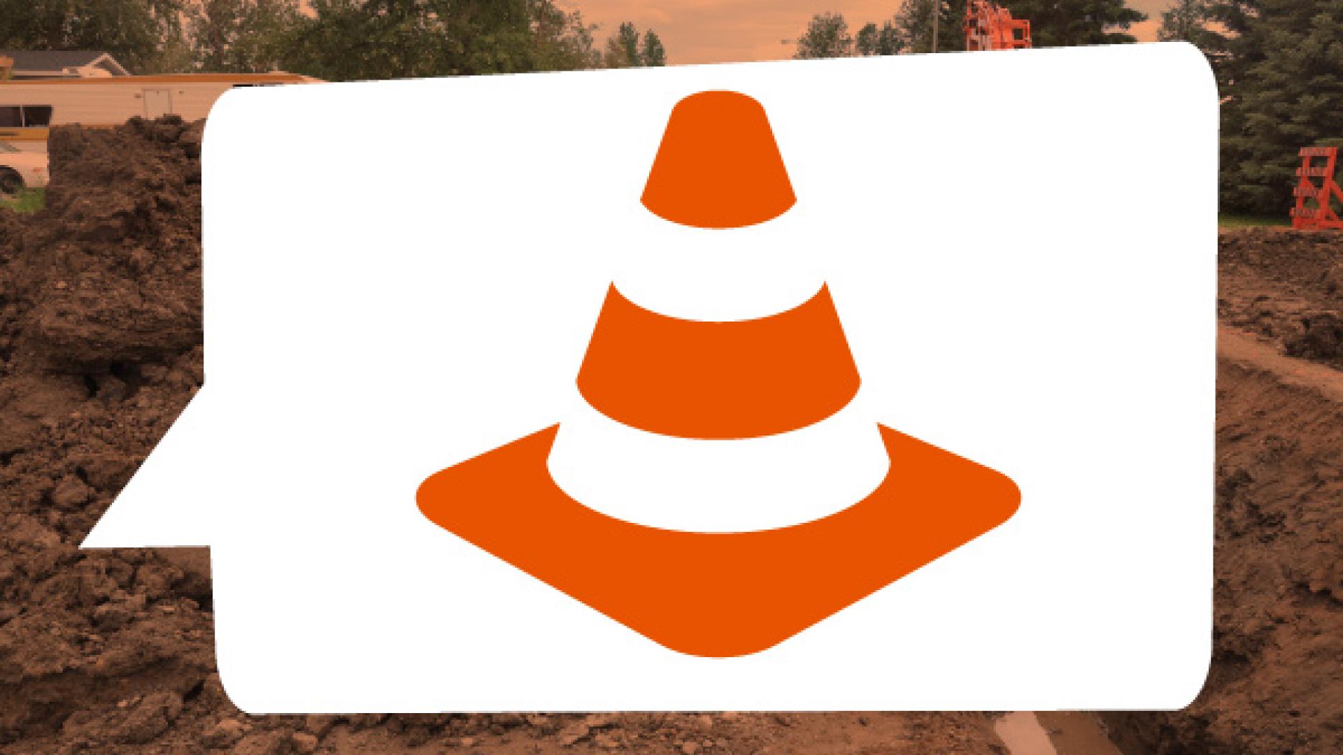 An orange cone in a comment bubble.
