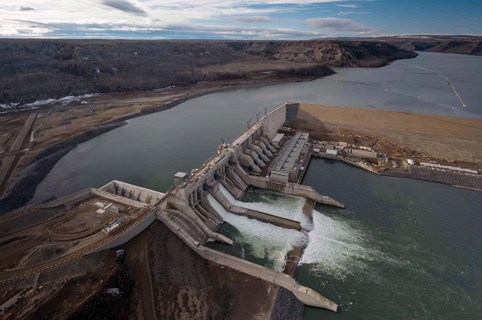 Construction on BC Hydro's Site C Dam completes and the reservoir fills.